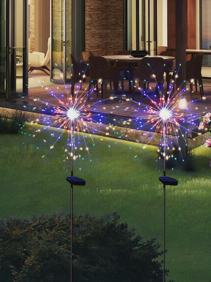 Solar firework lights changing colours at night