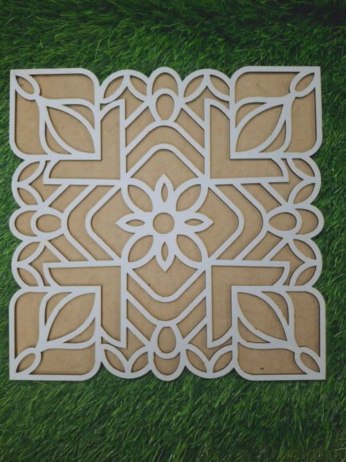 Filling the wooden rangoli stencil with colours