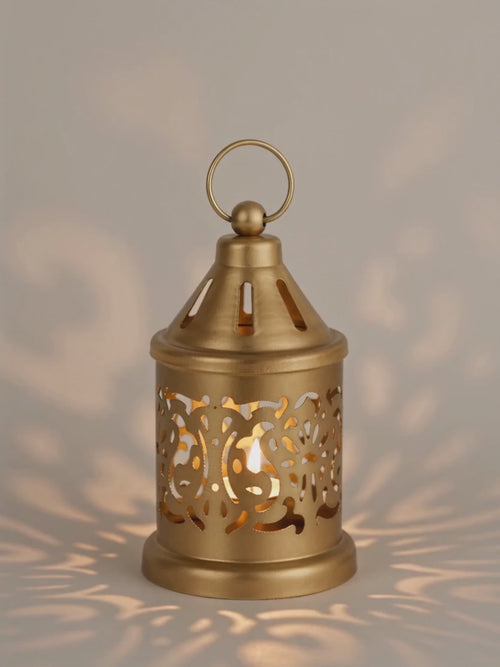 Golden lantern glowing with a tealight